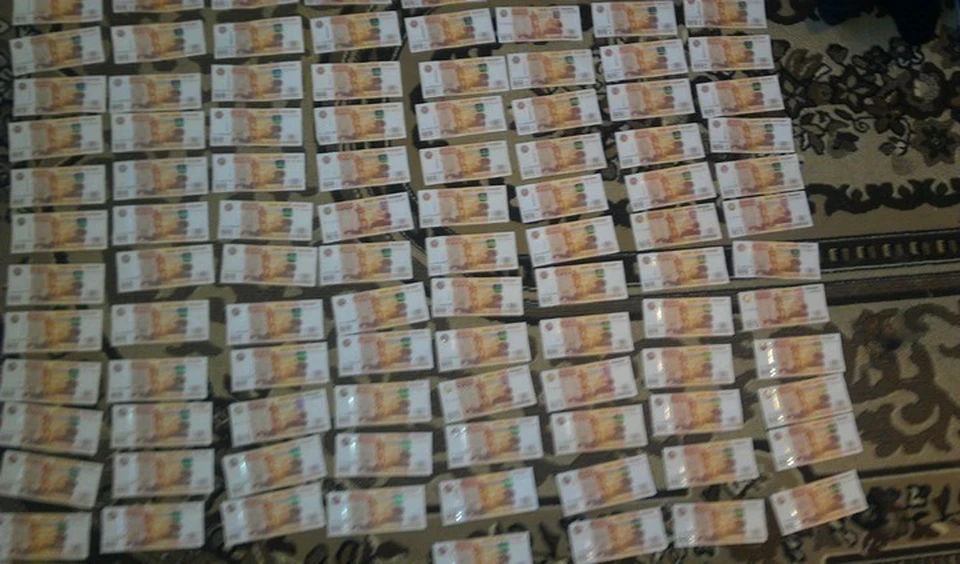 Кровавые деньги, из-за которых подозреваемый убил своего друга. Фото: СУ СК России п Красноярскому краю