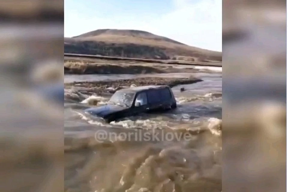 В окрестностях Норильска внедорожник унесло рекой. Стоп-кадр видео "norilsklove"