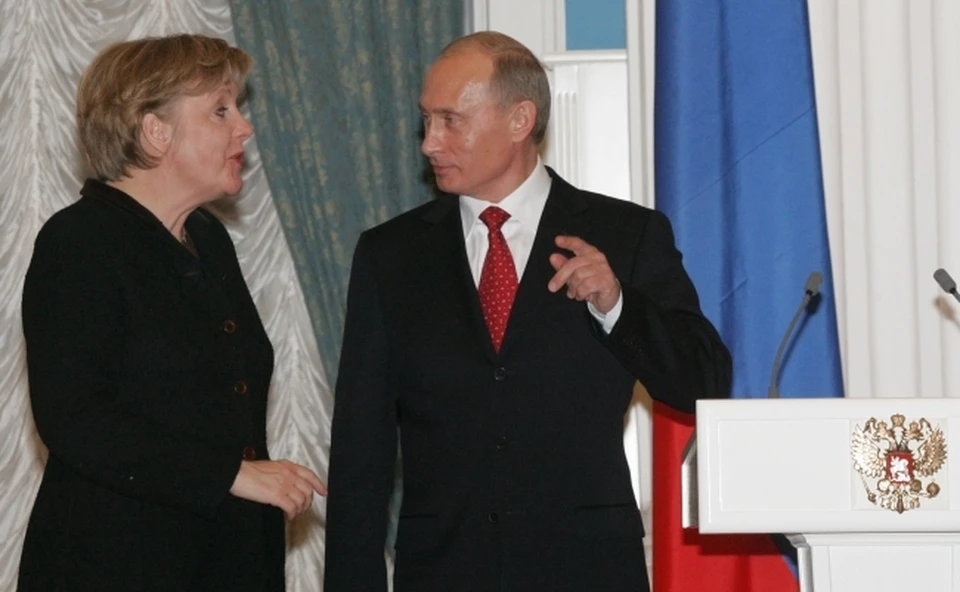И.о канцлера Германии Ангела Меркель и президент РФ Владимир Путин