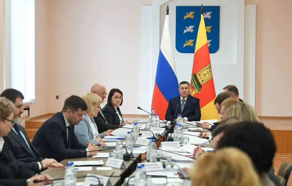 На совещании.